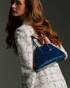 Model carrying the BASEL Midnight Blue bag on her arm