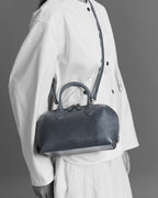 Model with the BOMBAY Mink Grey bag