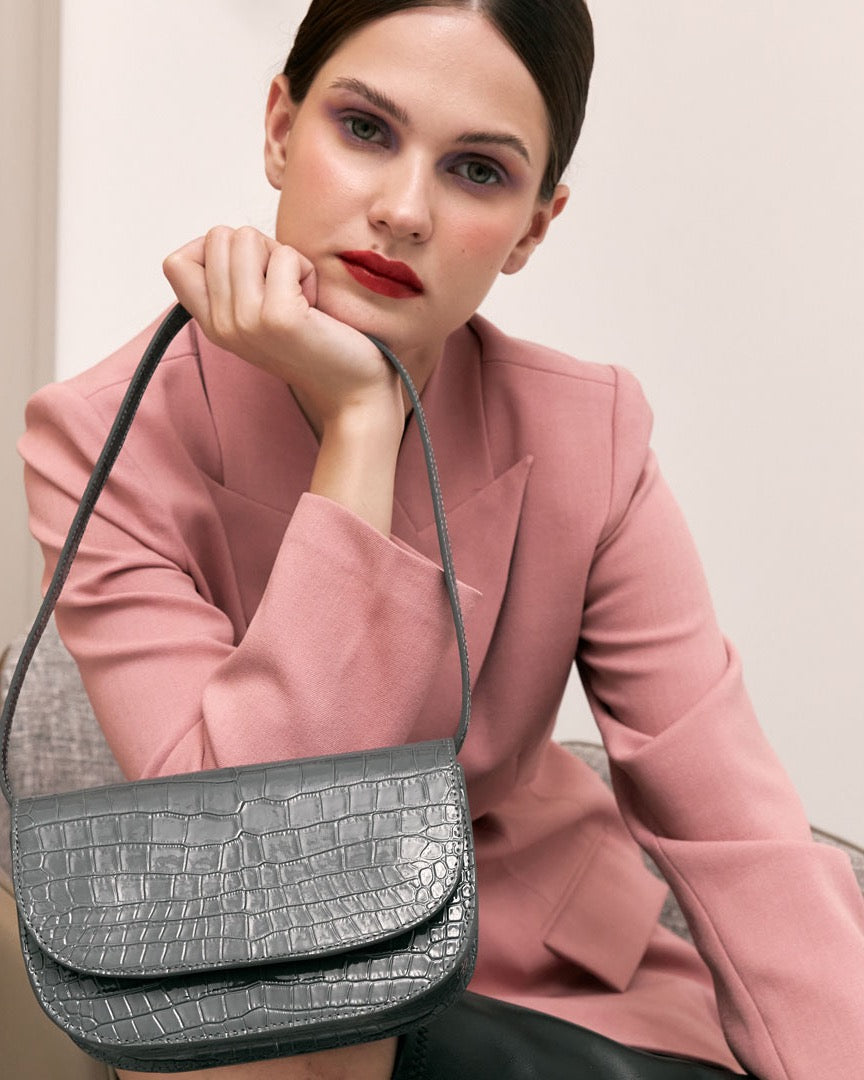 Model wearing the CARMEL Glacier Grey bag on her shoulder