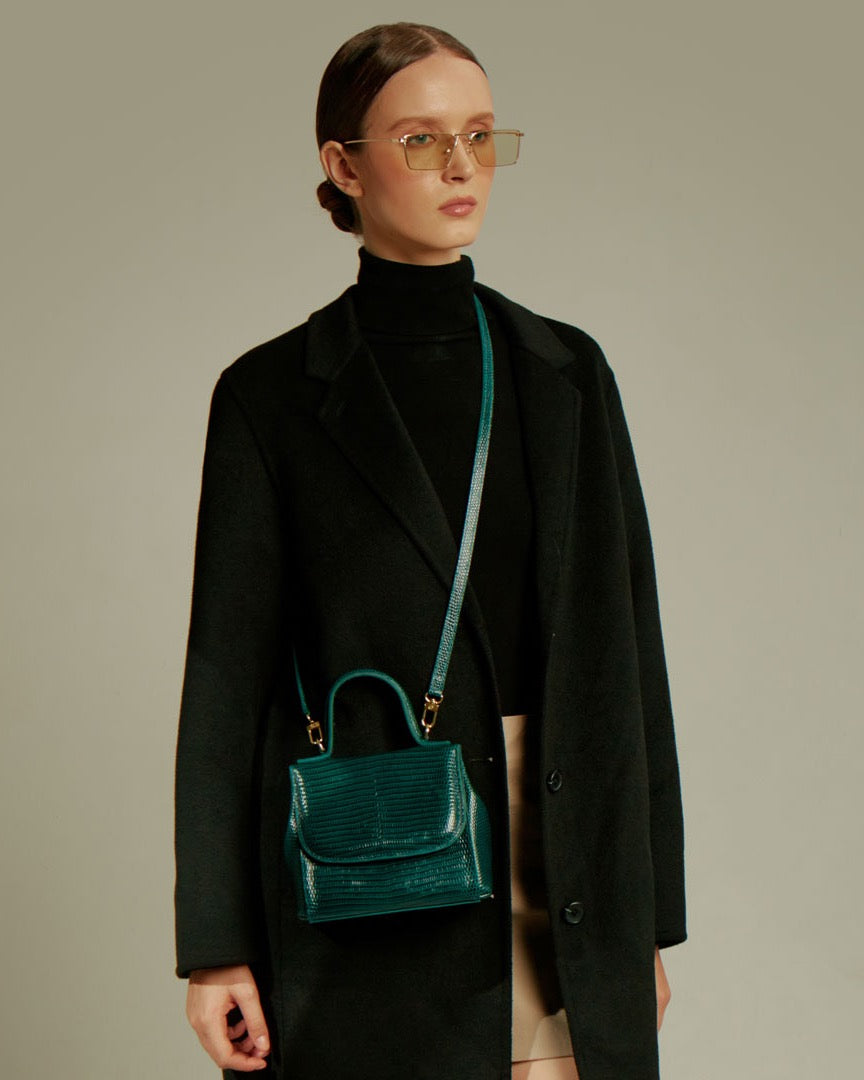 Model wearing the FLORENCE Lizard Dark Green bag crossbody