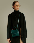Model wearing the FLORENCE Lizard Dark Green bag crossbody