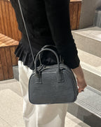 Model with the LUCCA Lizard Mink Grey bag
